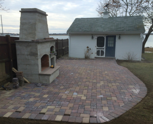 Outdoor Fireplace and paved area under construction