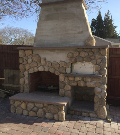Outdoor Fireplace and paved area